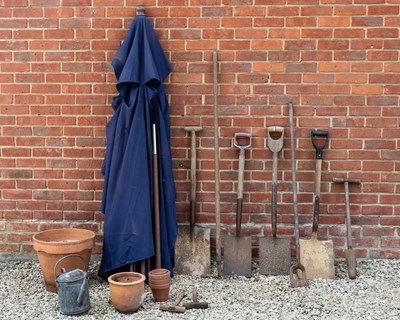 Lot 1196 - A small group of terracotta flower pots and various garden tools