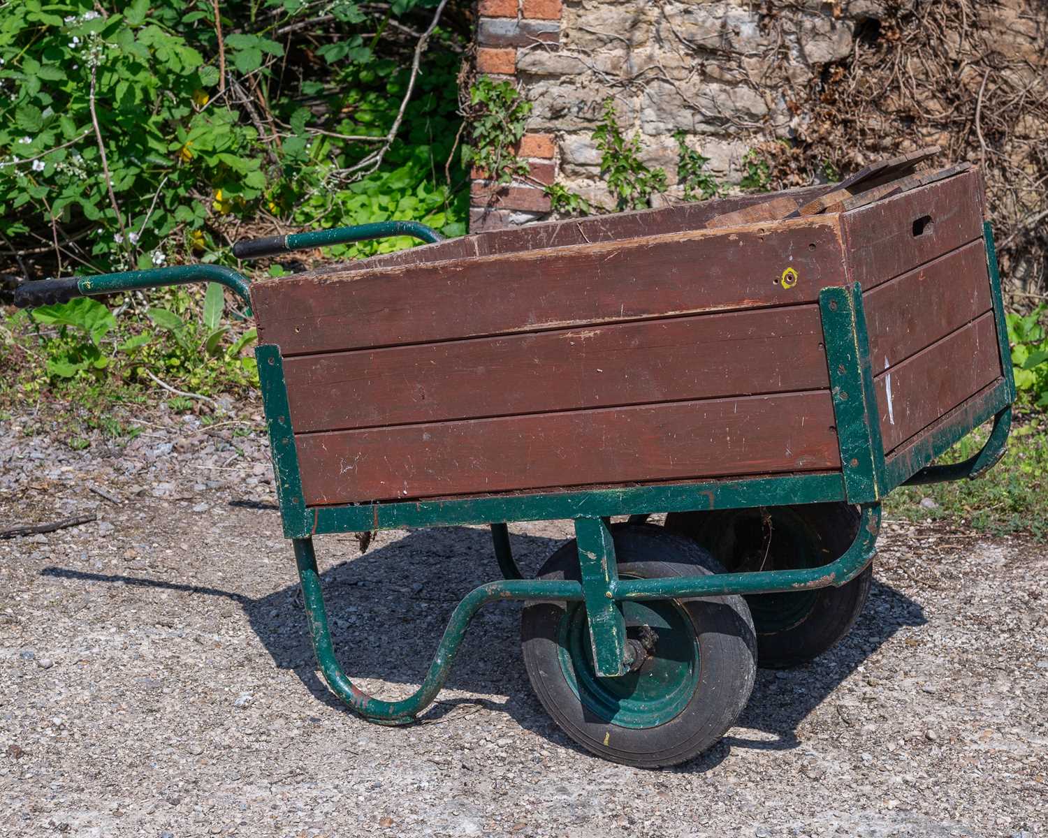 Lot 1352 - An old wooden two-wheeled barrow