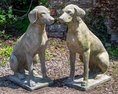 Lot 1308 - A pair of weathered cast reconstituted stone sculptures of seated labradors