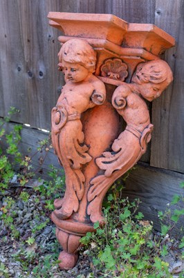 Lot 1194 - A decorative cast terracotta-coloured corbel