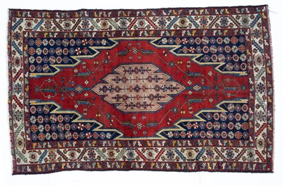 Lot 1045 - An antique Mazlagan red and blue ground rug