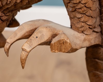 Lot 1314 - A carved Oriental hardwood sculpture of a dragon