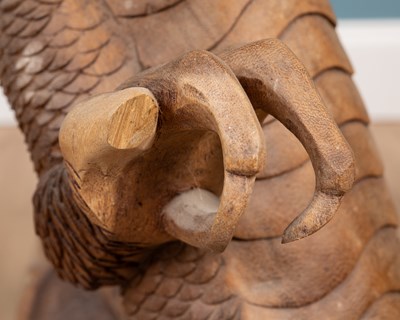 Lot 1314 - A carved Oriental hardwood sculpture of a dragon