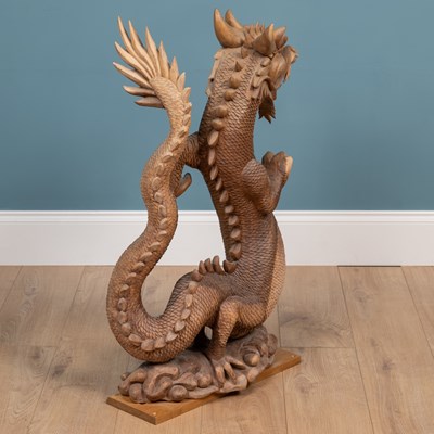 Lot 1314 - A carved Oriental hardwood sculpture of a dragon