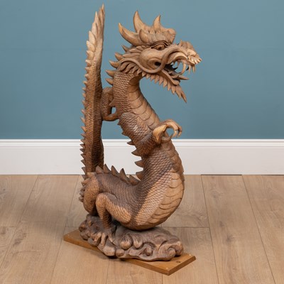 Lot 1314 - A carved Oriental hardwood sculpture of a dragon