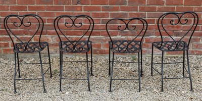 Lot 1309 - A set of four black painted wrought iron garden chairs