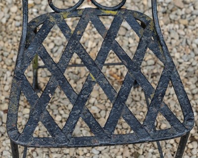 Lot 1309 - A set of four black painted wrought iron garden chairs