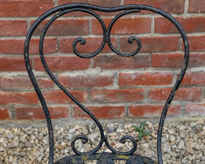 Lot 1309 - A set of four black painted wrought iron garden chairs