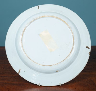 Lot 439 - An 18th century English Delftware large plate or charger, possibly Lambeth