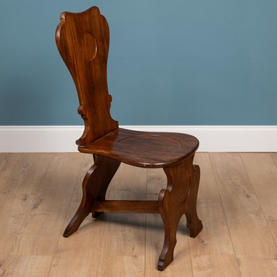 Lot 8 - A George II scabello style hall chair