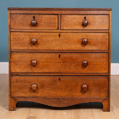 Lot 484 - A 19th century oak chest of two short and three long drawers