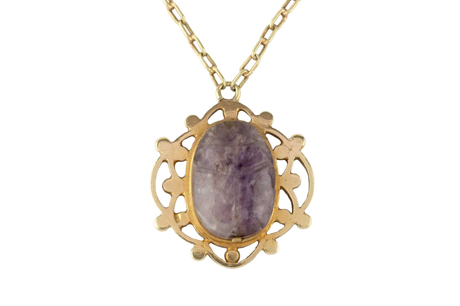 Lot 56 - A scarab pendant, the openwork panel centred...