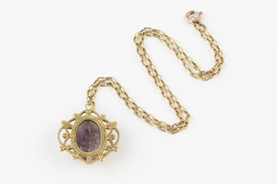 Lot 56 - A scarab pendant, the openwork panel centred...
