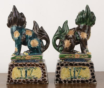 Lot 125 - Pair of polychrome models of temple dogs...