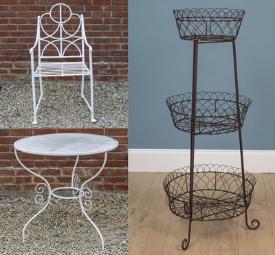 Lot 1294 - A white painted wrought iron garden chair; a circular garden table; and a three-tier plant stand