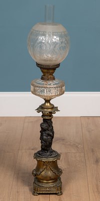 Lot 116 - Antique brass and spelter oil lamp  with glass...