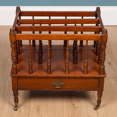 Lot 223 - A walnut Canterbury