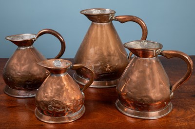 Lot 328 - A group of four various copper haystack measures