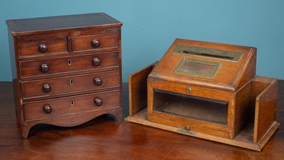 Lot 335 - A posting box from Kenfield Hall, together with a mahogany miniature chest of drawers