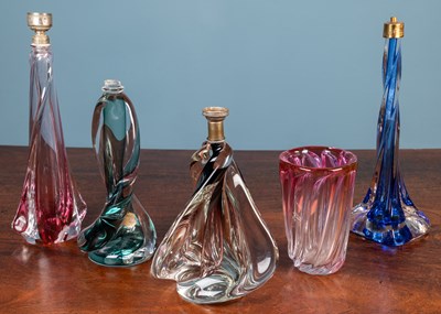 Lot 551 - A group of four Val St Lambert glass table lamp bases together with a vase by the same maker