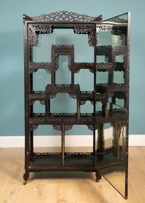 Lot 306 - A Chinese ebony display cabinet