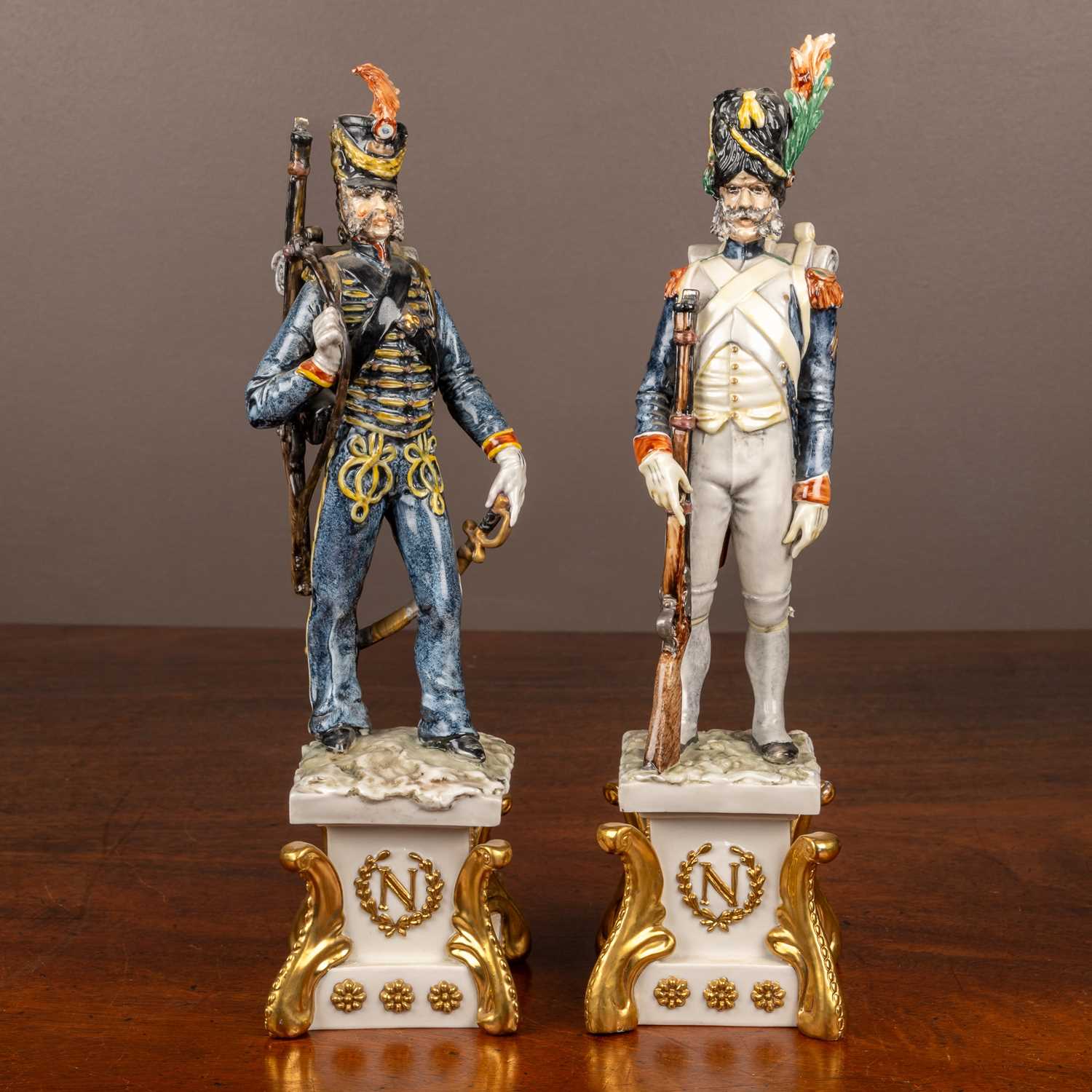 Lot 69 - A pair of porcelain models of Napoleonic soldiers by Guido Cacciapusti