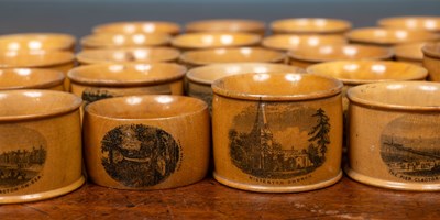 Lot 87 - A collection of thirty five 19th century and later turned Mauchline ware napkin rings