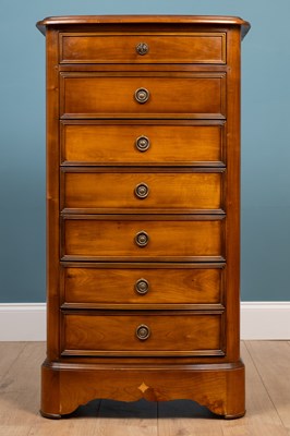 Lot 147 - A Brigitte Forester cherrywood narrow chest of seven drawers