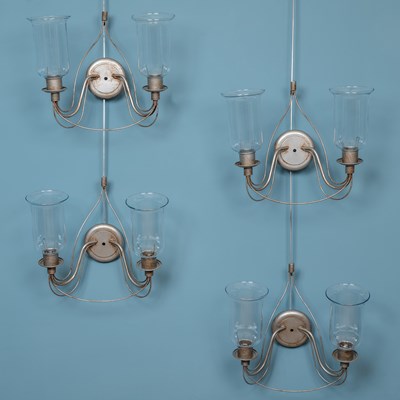 Lot 529 - A set of four painted wrought iron wall lights