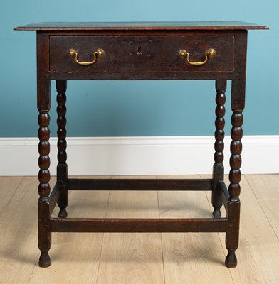 Lot 365 - A George III oak country made side table