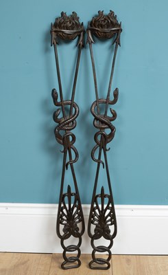 Lot 1320 - A pair of cast bronze mounts, possibly architectural furniture mounts