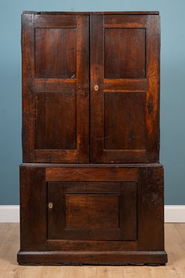 Lot 349 - A George III oak Country House cupboard