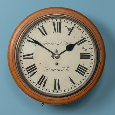 Lot 196 - An Edwardian mahogany cased circular dial clock retailed by Harrods Ltd, London