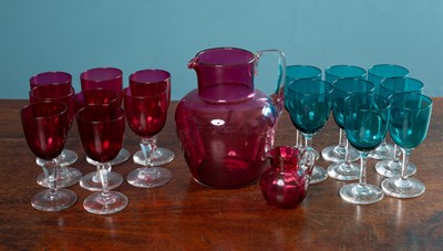 Lot 133 - Sixteen wine glasses and two cranberry glass jugs