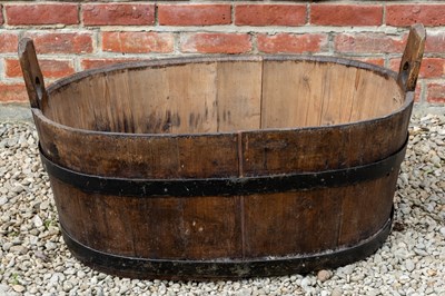 Lot 1203 - A coopered pine oval tub