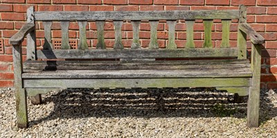 Lot 1250 - An old teak garden bench