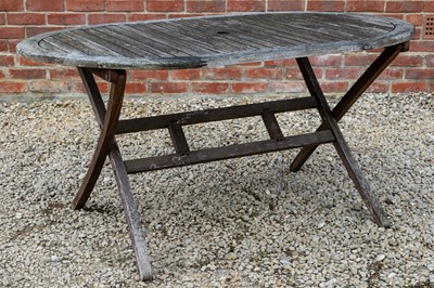 Lot 1266 - A folding teak garden dining table with a set of six matching folding chairs