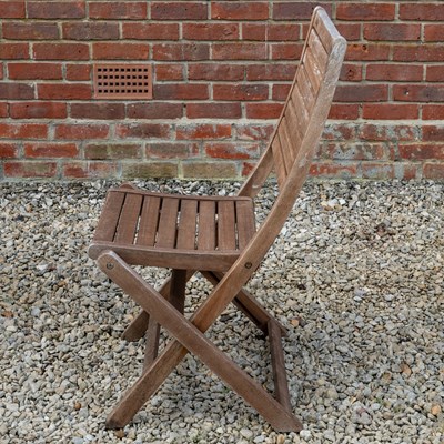 Lot 1266 - A folding teak garden dining table with a set of six matching folding chairs