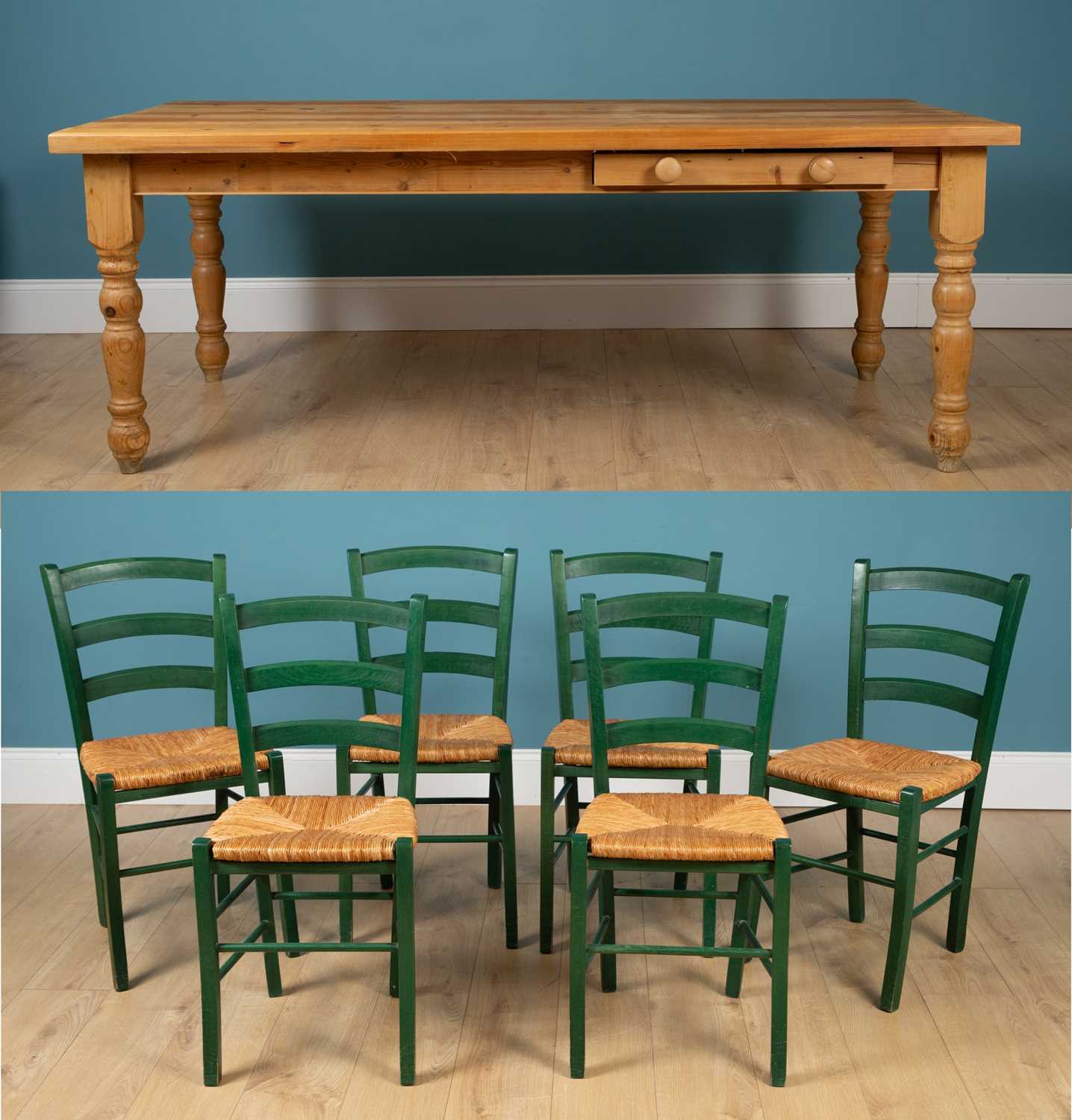 Lot 335 - A modern pine kitchen table with a single...