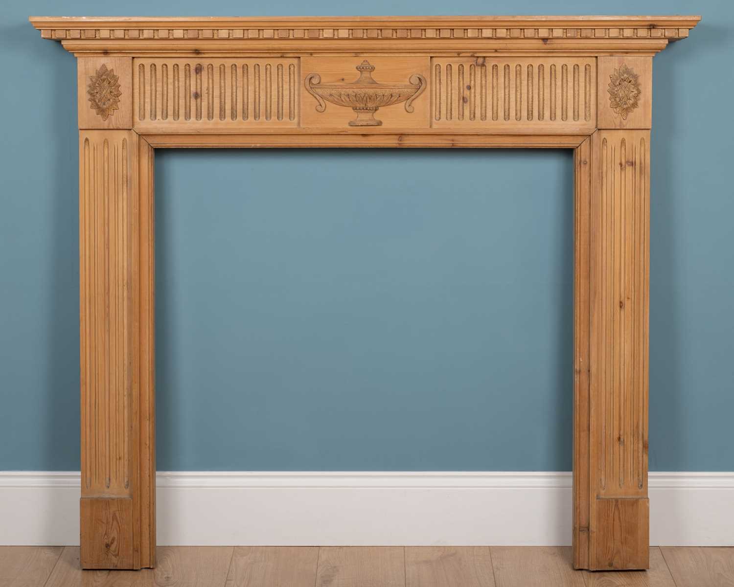 Lot 542 - A pine fire surround carved in the Adams style