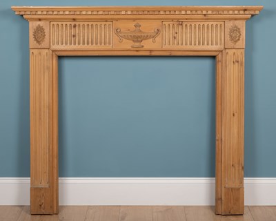 Lot 542 - A pine fire surround carved in the Adams style