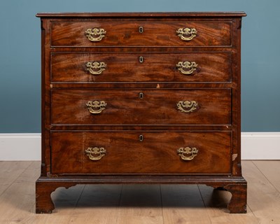 Lot 185 - A George III mahogany small sized chest of four long graduated drawers