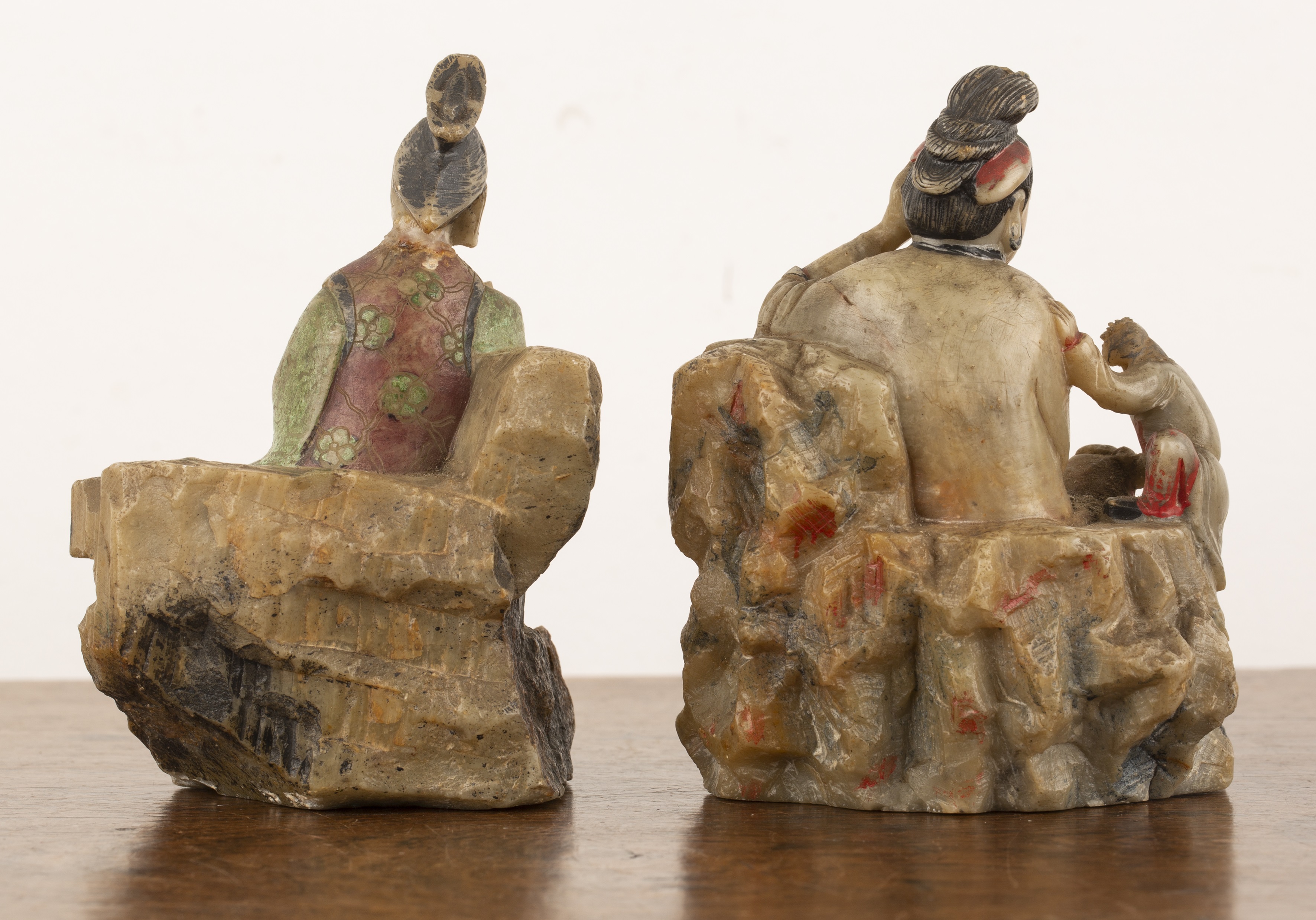 Lot 249 Two carved and painted soapstone figures