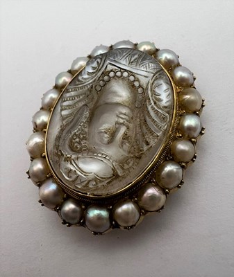 Lot 74 - A moonstone and half pearl cameo...