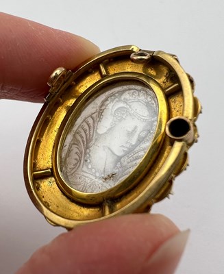 Lot 74 - A moonstone and half pearl cameo...