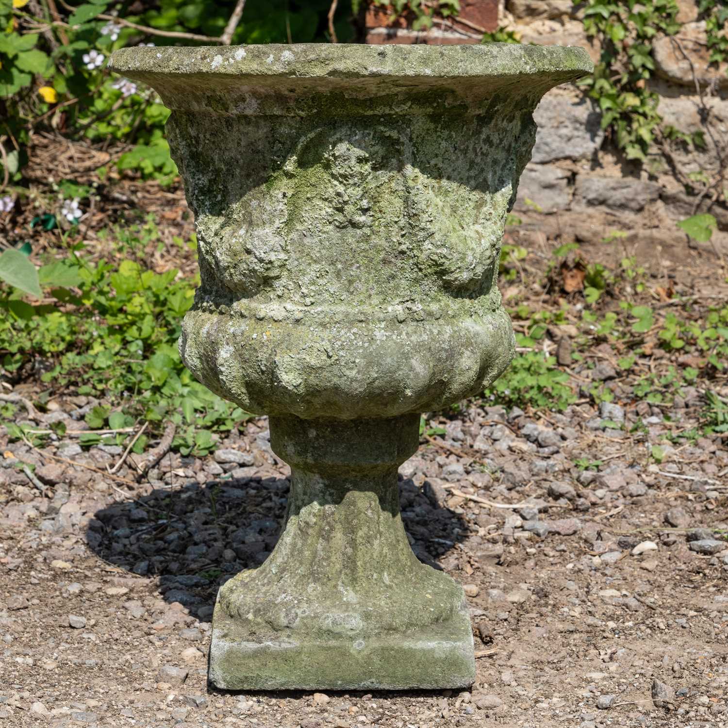 Lot 1366 - A cast reconstituted stone garden urn