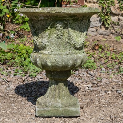 Lot 1366 - A cast reconstituted stone garden urn