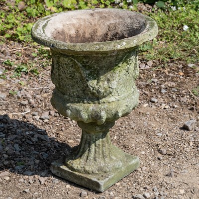 Lot 1366 - A cast reconstituted stone garden urn