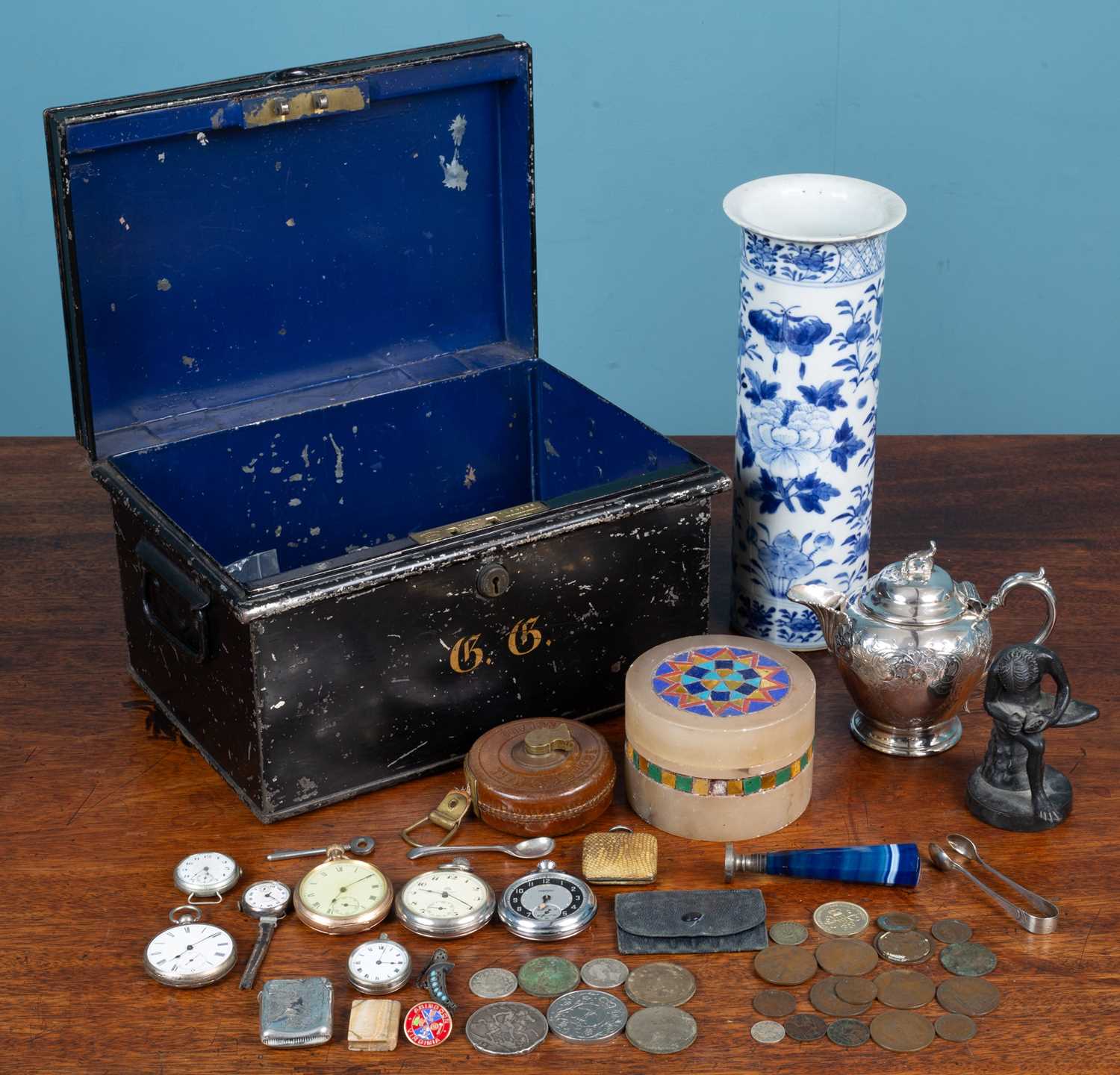 Lot 14 - A collection of items to include silver, a bronze statuette and but markers
