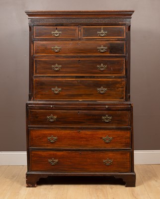 Lot 112 - A 20th century stained wood chest on chest